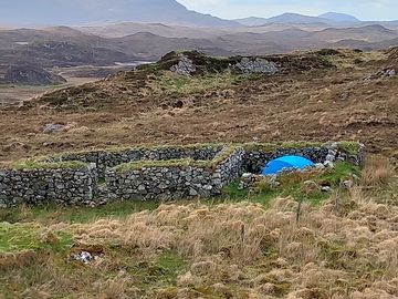 Sheltered tent pitch