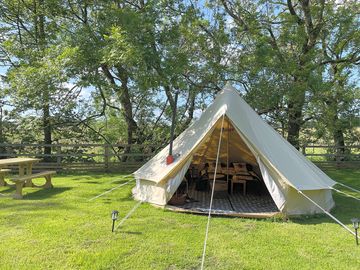 Bell tent with a picnic table