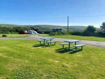 Upper field pitches and outside seating by bar