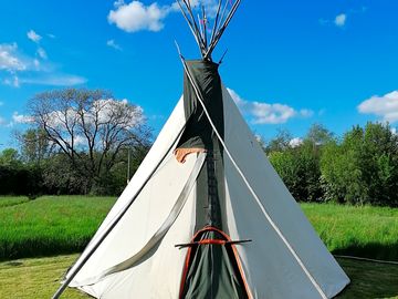 Optional communal tipi for extra social space