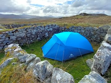 Sheltered tent pitch