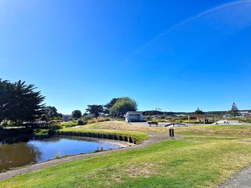 Nearby park with playground, duck pond and toilets