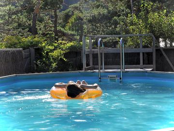 Outdoor pool with a view of the surrounding mountains (added by manager 21 Oct 2019)