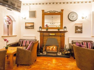 Lounge bar with comfy seating and open fire