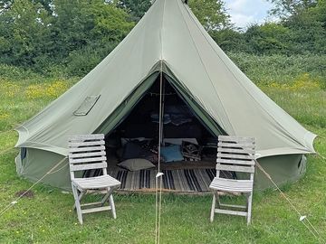 Bell tent surrounded by trees