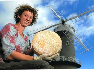 Elly chalmers with a wheel of delicious norfolk charm cheese