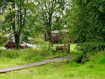 Carpark a short walk to the yurt across a small bridge.