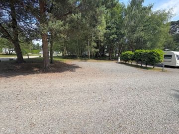 Fully-serviced hardstanding pitch with electric, water, and grey waste disposal