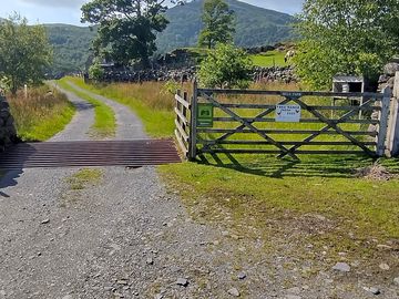 Cattle grid and track at the site entrance