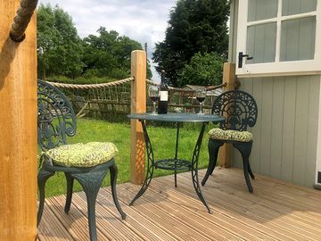 A glass of wine on the deck