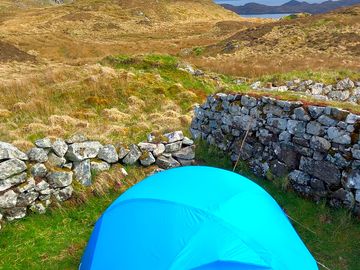 Sheltered tent pitch