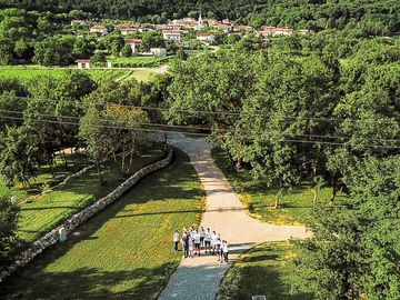 Team kamp david with malovše village and kucelj hill in the background