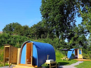 Toilet/shower pod and shared outdoor sink