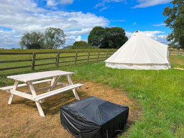 Picnic table normally covered with the event shelter which will be up on your arrival