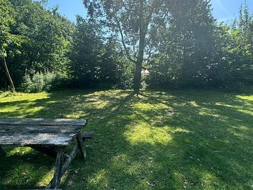 Large camping pitch in the shade of the eucalyptus tree
