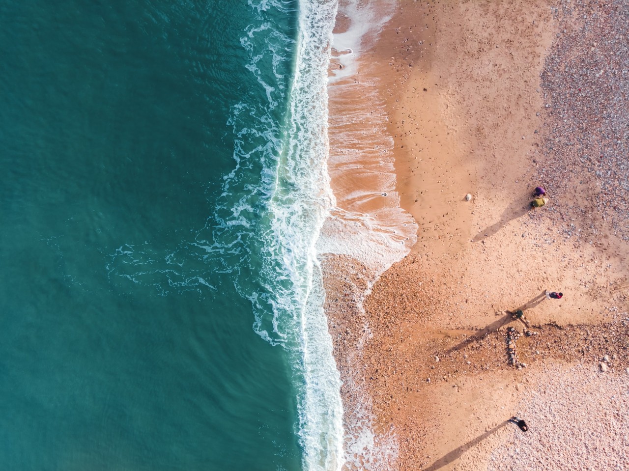 People looking for sea glass at Seaham Beach (Martin Burdon on Unsplash) People looking for sea glass at Seaham Beach (Martin Burdon on Unsplash)