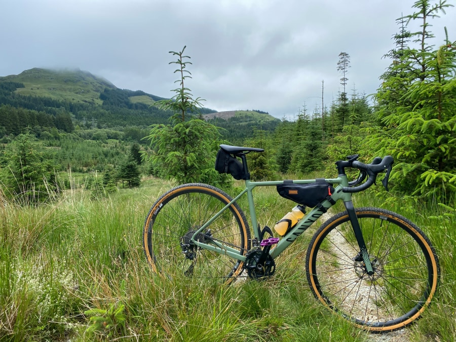Bike with the Arrochar Alps in the distance (Darren Cowie/Unsplash)