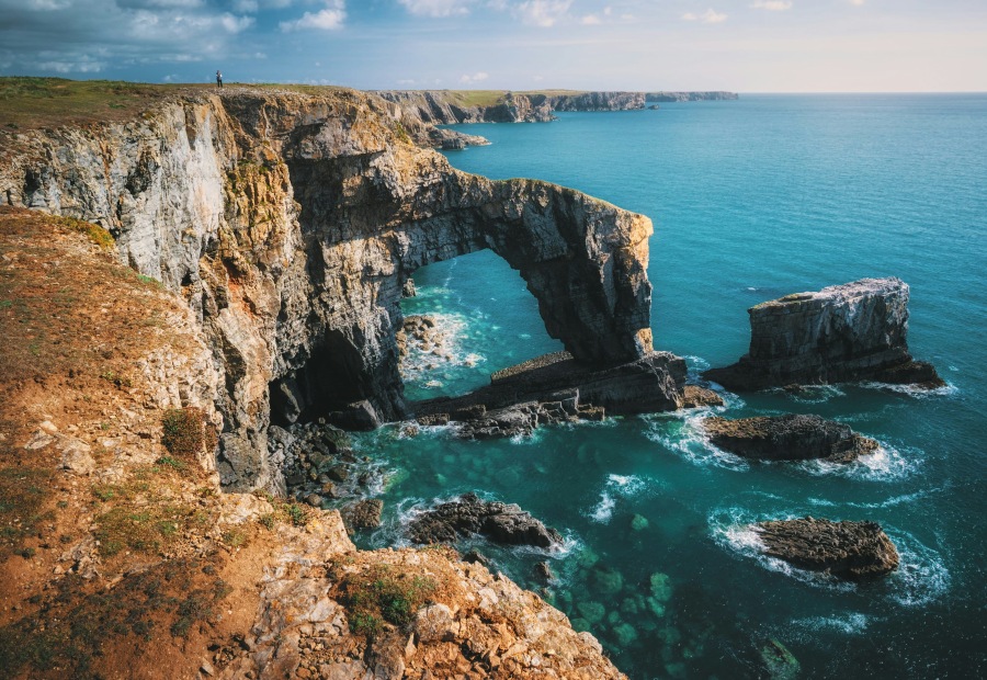 The Green Bridge of Wales is one of the highlights of the Pembrokeshire Coast Path (Ian Cylkowski/Unsplash)