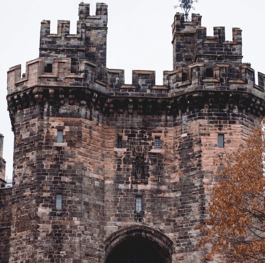 The austere facade of Lancaster Castle (Jonny Gios/Unsplash)