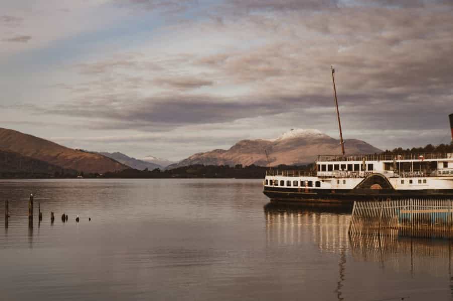 Boats at Tarbet (Eilis Garvey/Unsplash)