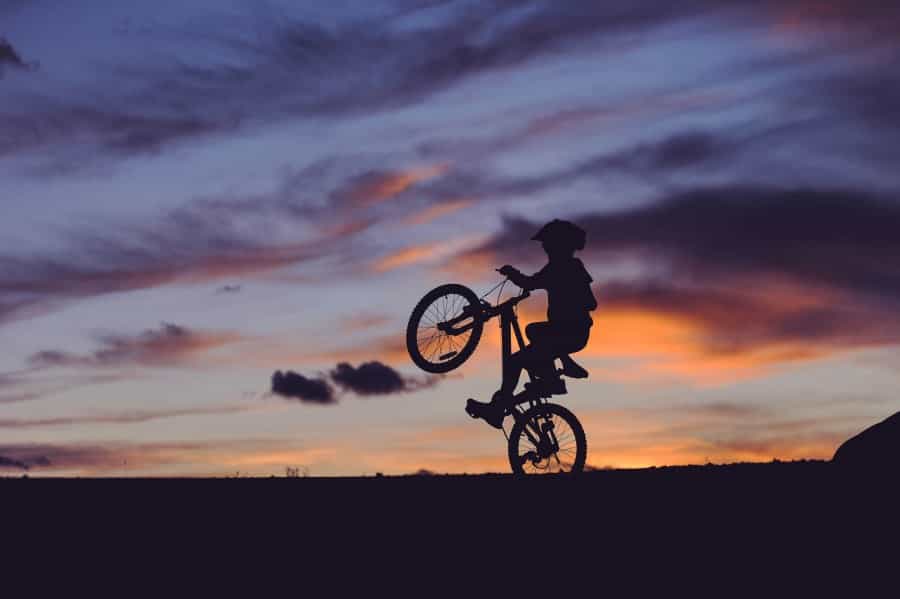 Mountain biker at sunset (Clark Young/Unsplash)