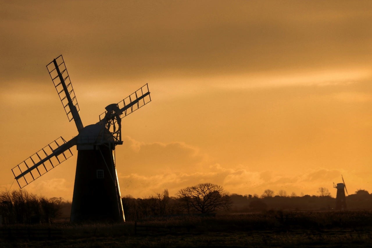 Windmills at sunrise in the Broads National Park by Will Hulbert
