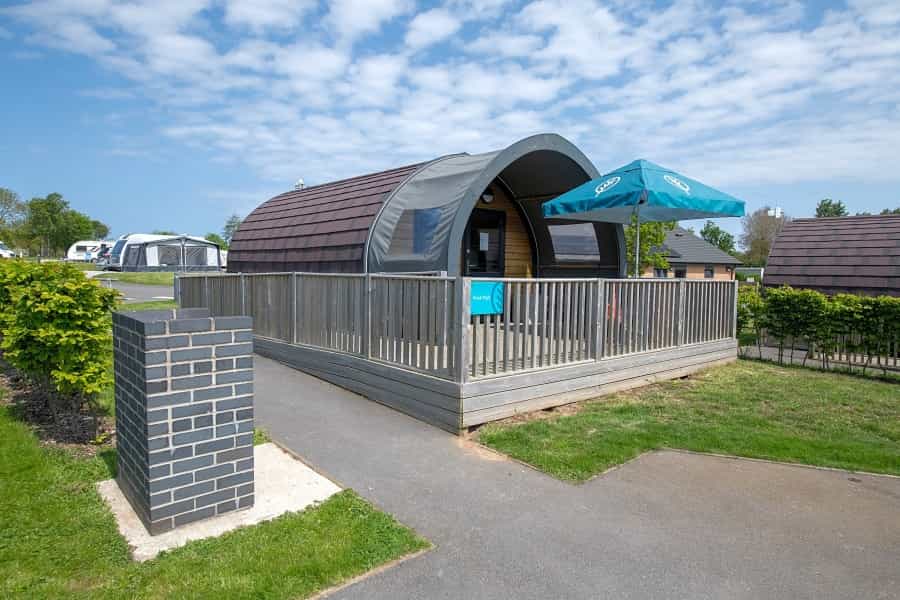An accessible log cabin with access ramp and step-free wide patio doors