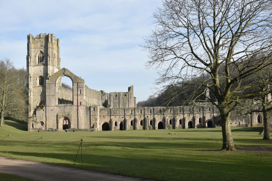 The atmospheric ruins of Fountains Abbey (Chris J Walker/Unsplash)
