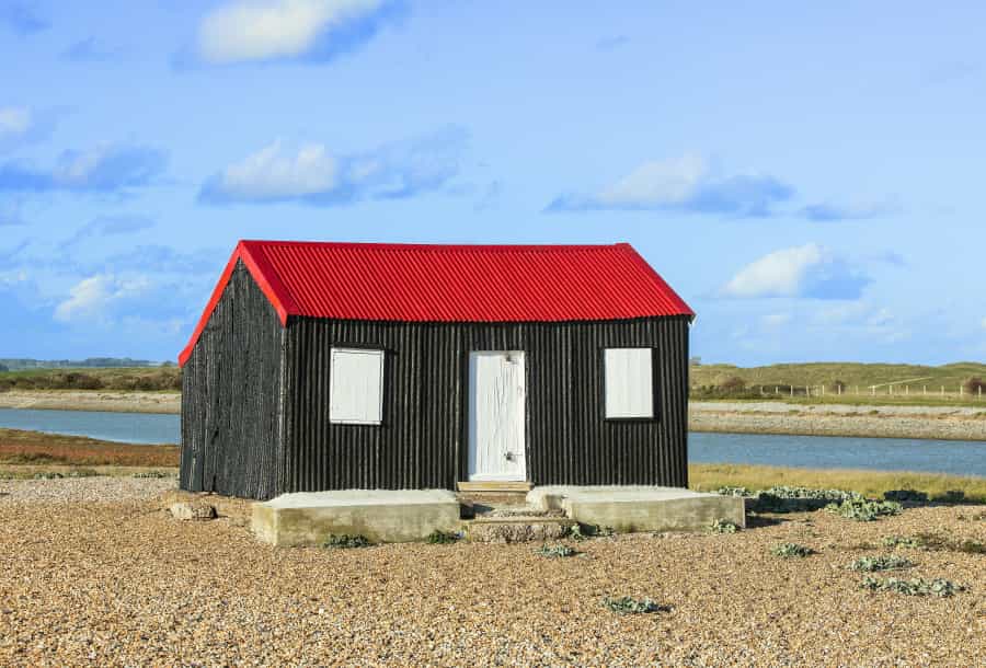 Red-roofed hut at Rye Harbour nature reserve (Paul Harris/Unsplash)